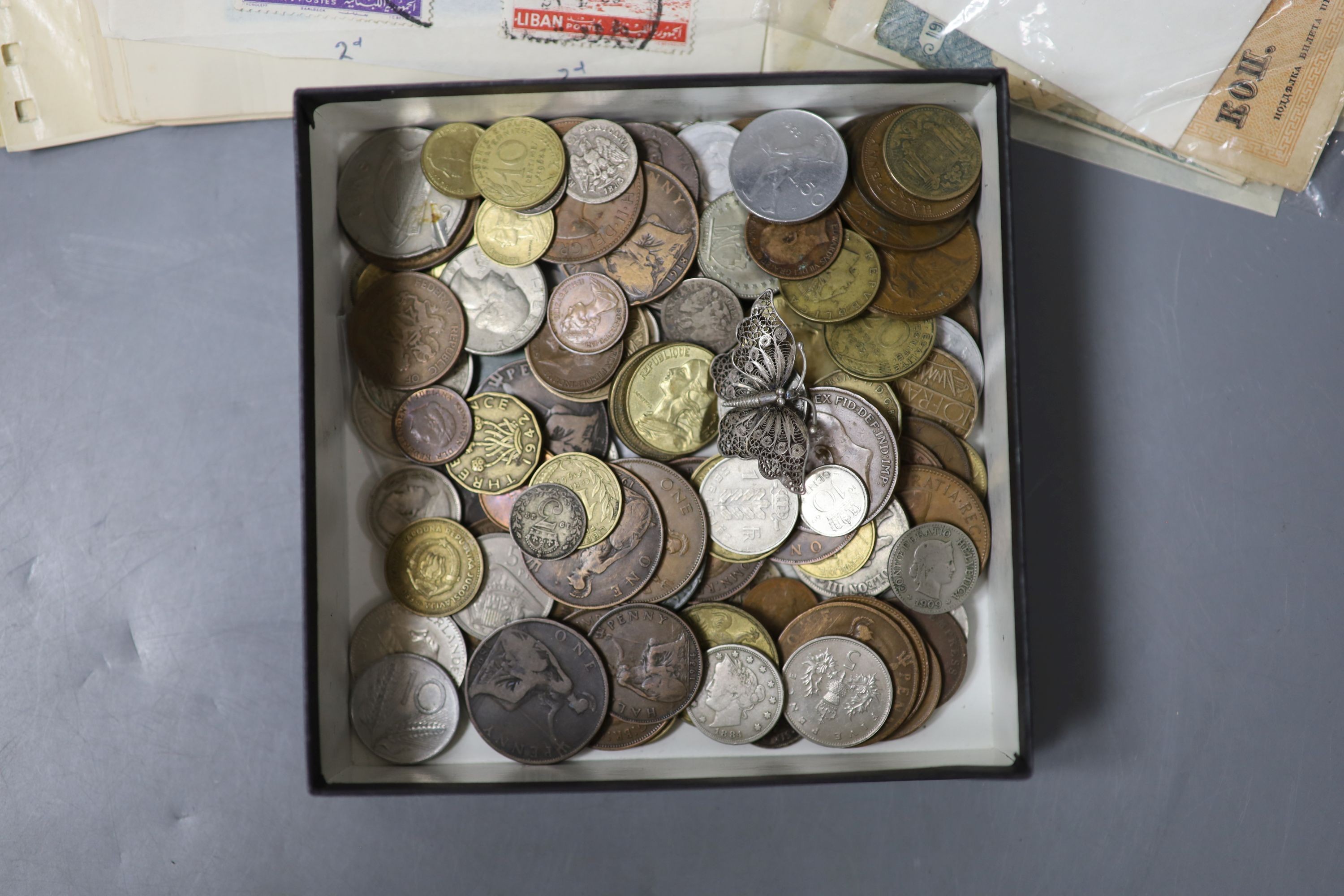 A collection of miscellaneous coins, stamps and banknotes